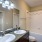 Bathroom features a tub and dual sinks