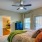 Bedroom has a large window and a door to the patio