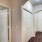 Hallway has arches and overhead lights