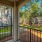 Patio is surrounded by lush landscaping